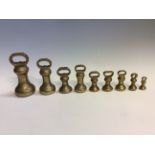 A set of nine graduated bell weights. IMPORTANT: Online viewing and bidding only. Collection by