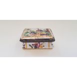 A hand painted enamel pill box with peacock design to top and floral design to sides. IMPORTANT: