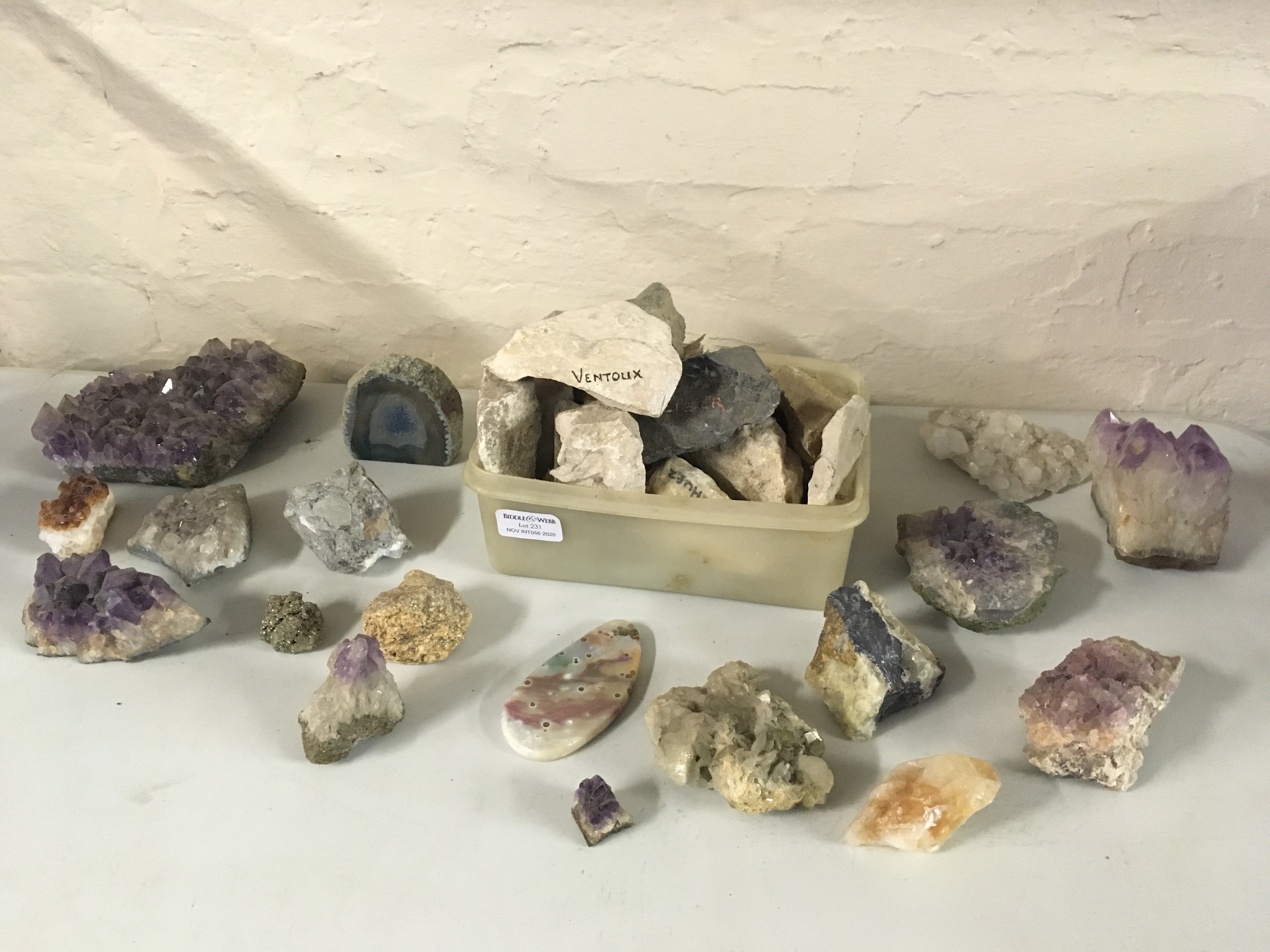 A collection of various rocks, some with gemstones including amethyst. IMPORTANT: Online viewing and