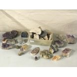 A collection of various rocks, some with gemstones including amethyst. IMPORTANT: Online viewing and