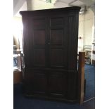 A 19th century oak panel front four door large corner cupboard. IMPORTANT: Online viewing and