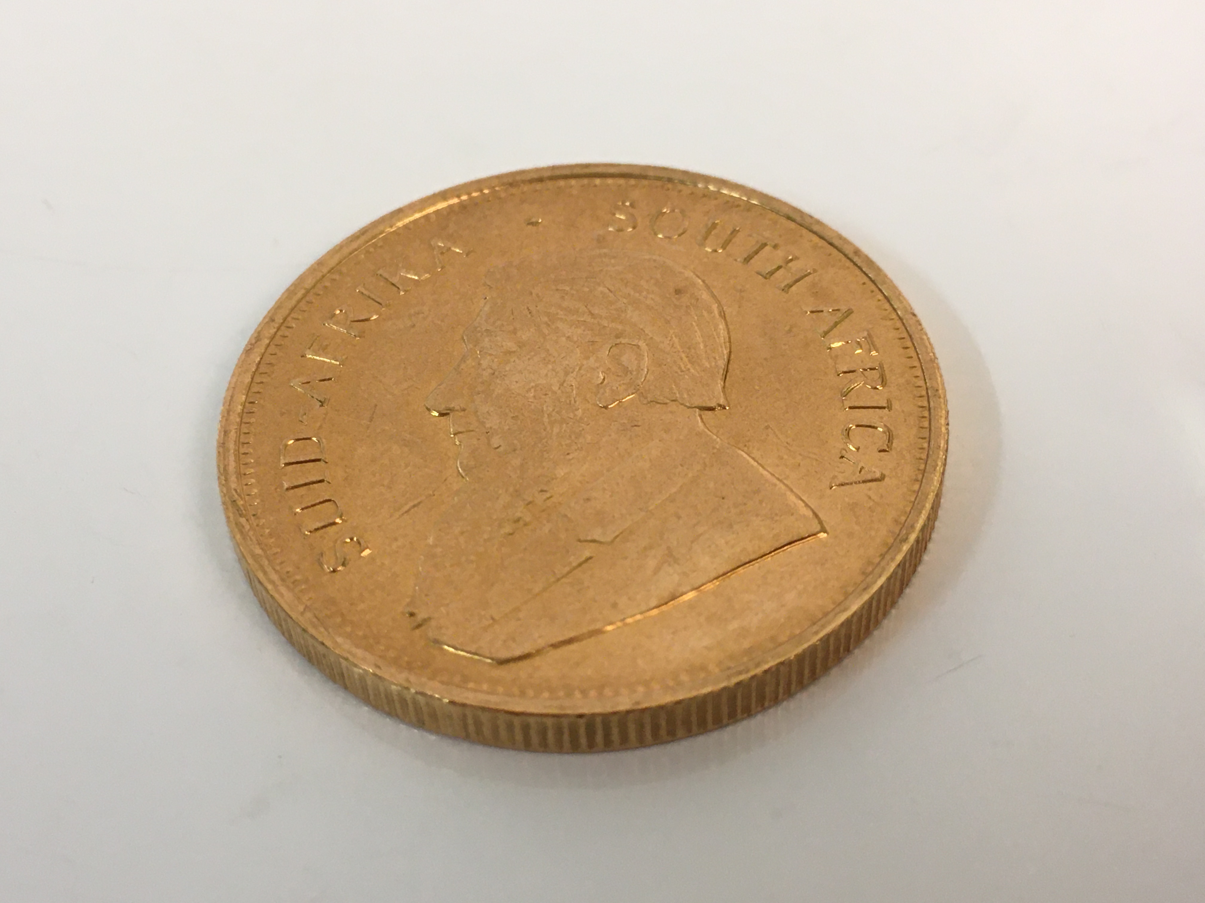 A 1974 1oz fine gold Krugerrand. *Sold without buyers premium. Online viewing and bidding only. No - Image 2 of 2