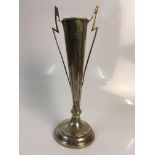 A two handled silver vase with bow and flower design to front, damage to handle and base of stem,
