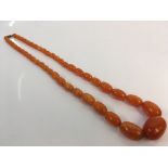 Amber bead necklace with 45 graduated beads. Online viewing and bidding only. No in person