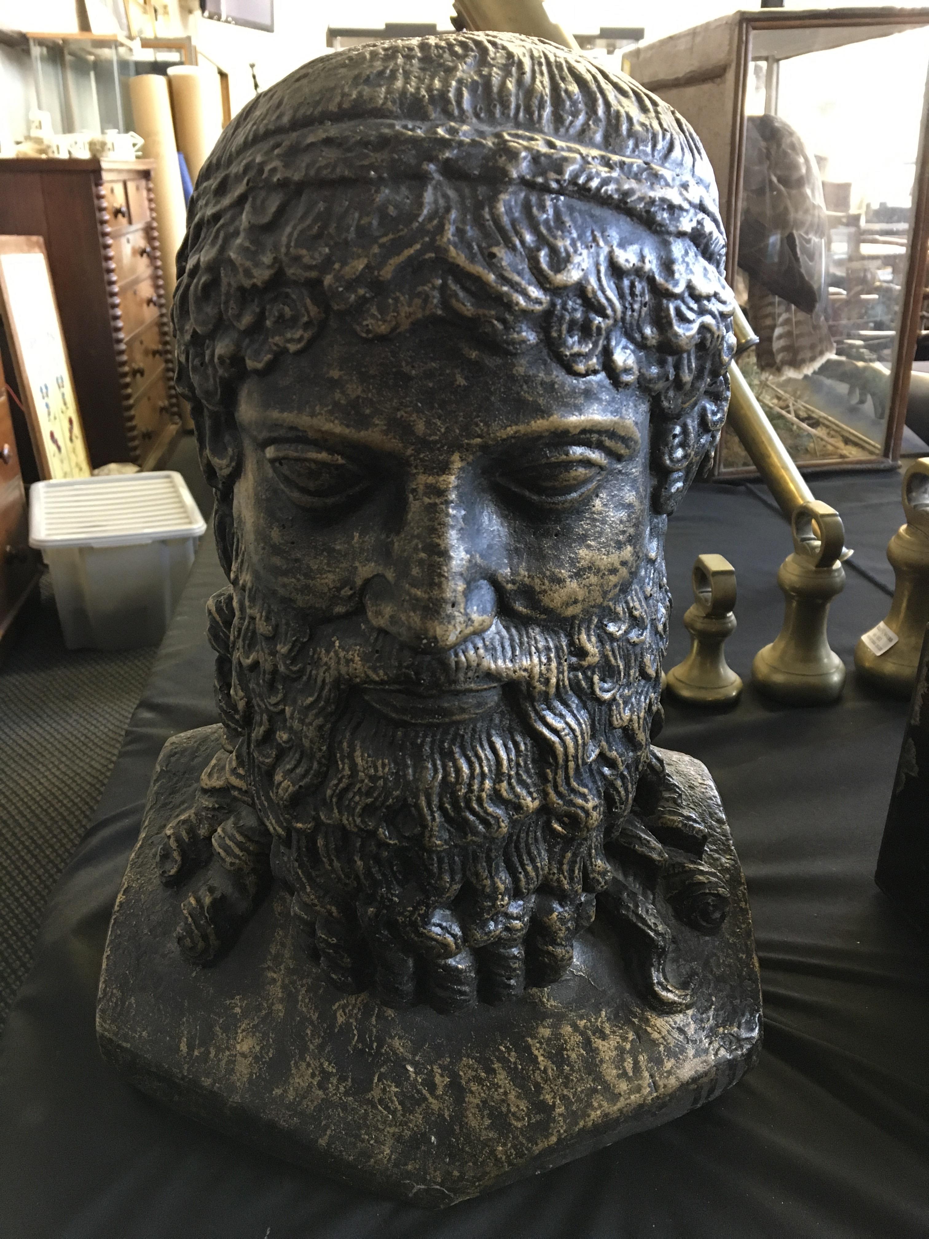 A concrete bust of Zeus with bronze finish, height 41cm. IMPORTANT: Online viewing and bidding only.