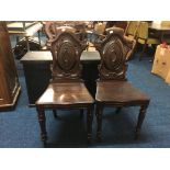 A pair of 19th century mahogany hall chairs. IMPORTANT: Online viewing and bidding only.