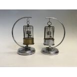 Two bird cage automaton clocks hanging on suspended stand. IMPORTANT: Online viewing and bidding
