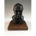 A bronze finished bust of Winston Churchill by Franta Belsky on wooden base, signed to back,