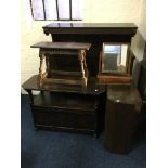 A collection of furniture to include an oak two door sideboard, monks bench, coffee table, mirror
