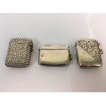 Three silver vesta cases, approx. total weight 90gms. Online viewing and bidding only. No in