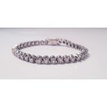 A tennis bracelet of approx. 38 diamonds, each diamond approx. 0.15ct, 750 marked on clasp,