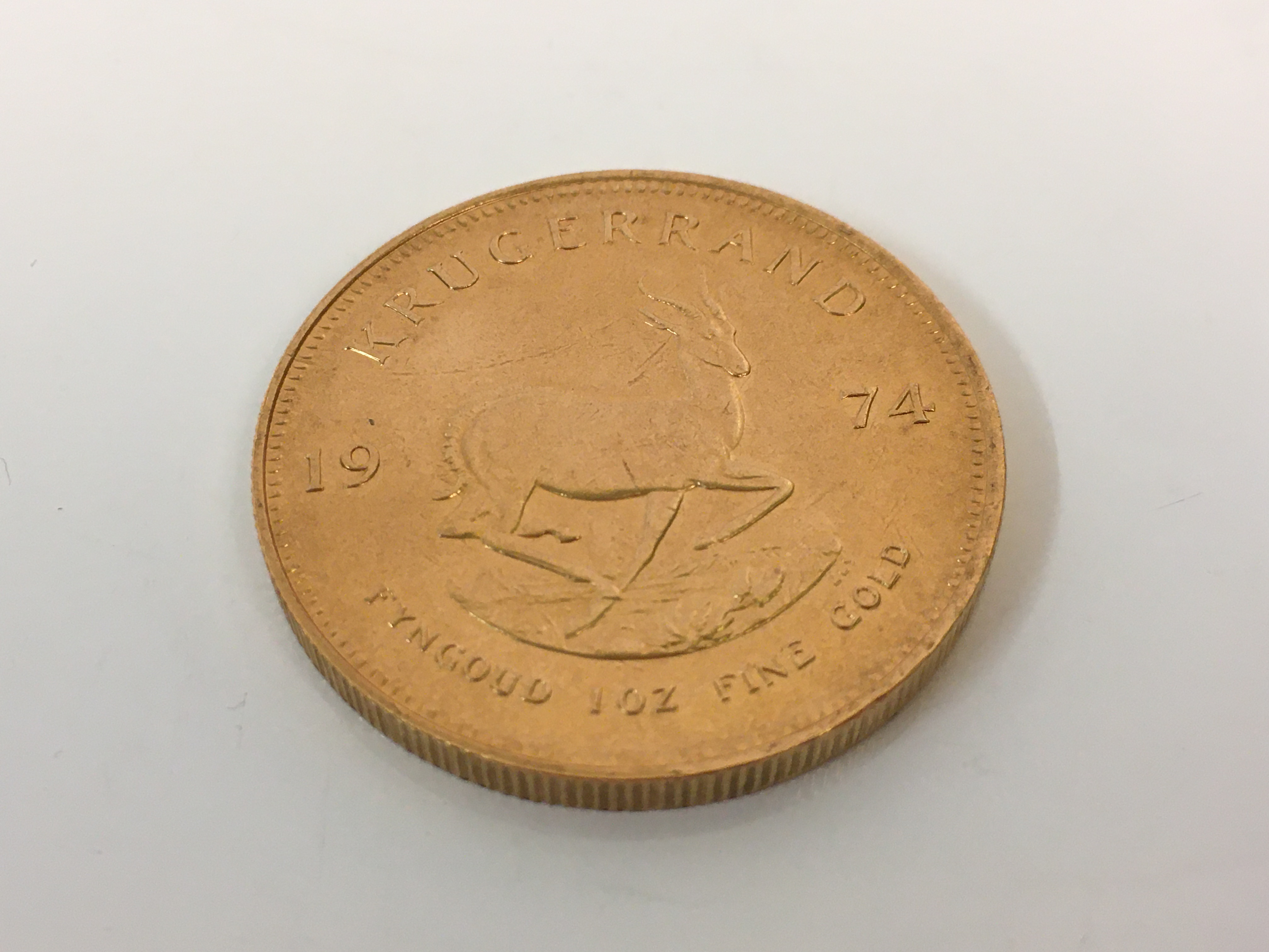 A 1974 1oz fine gold Krugerrand. *Sold without buyers premium. Online viewing and bidding only. No