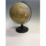 A Philips 12 inch terrestrial globe by George Philip & Son on single column base. IMPORTANT: