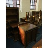 A 19th century mahogany swing mirror, nest of three walnut graduates coffee tables, monks bench,