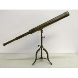 A brass two draw telescope on adjustable tripod base approx. telescope length 83.5cm. IMPORTANT: