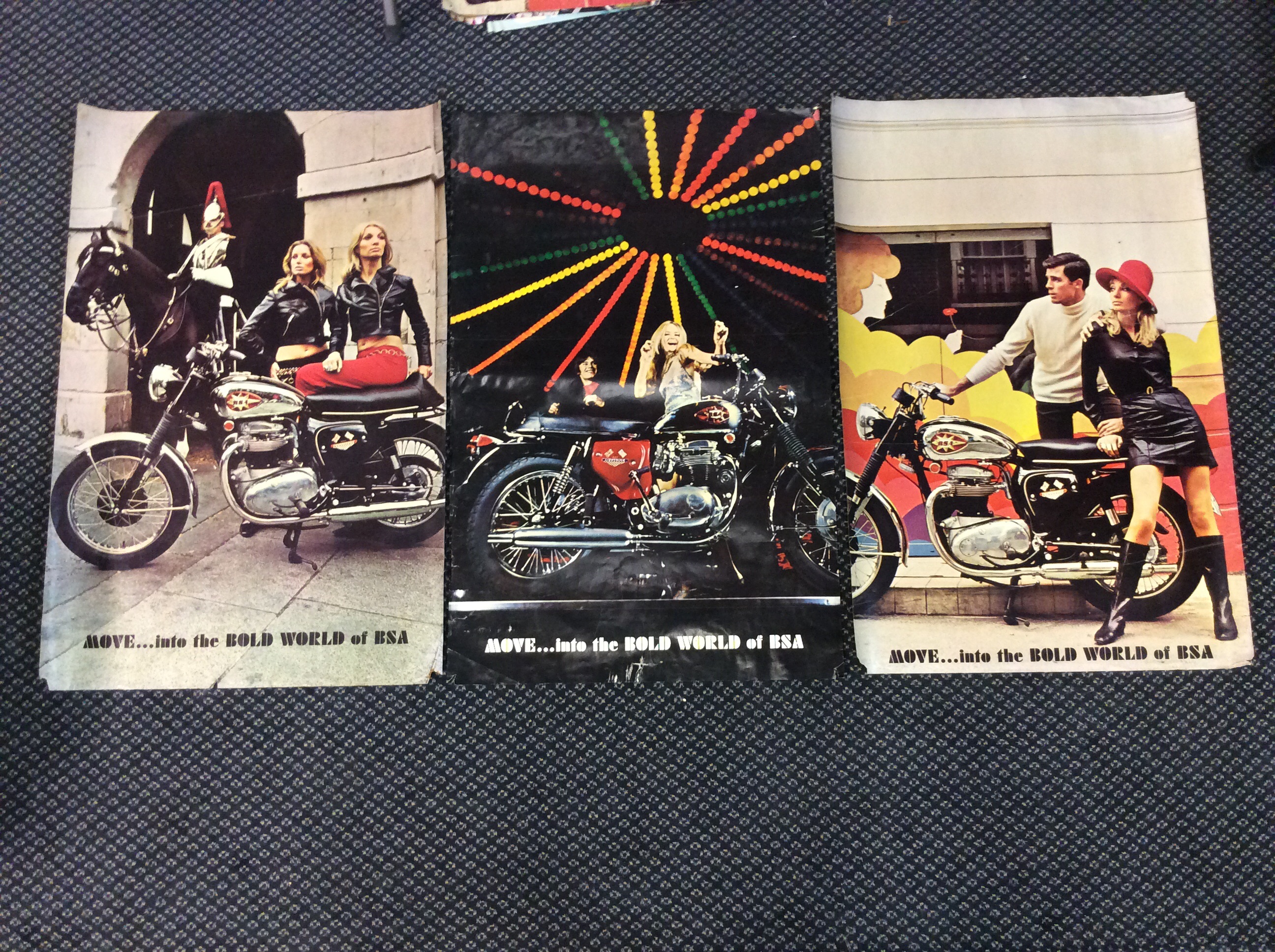 Three BSA Motorcycle advertising posters, two ‘Move into the bold world of BSA’, one ‘Get astride