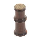 A turned lignum vitae 'Wheeler and Wilson Sewing Machine' needle case, metal numerical domed top,