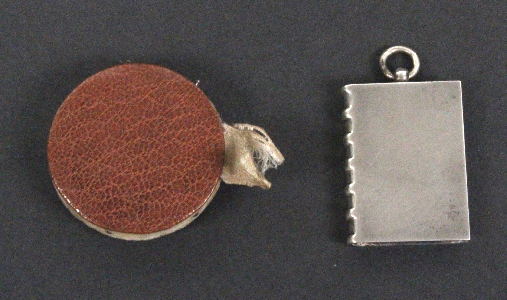 Two silver pin cushions, comprising a book form example, blue velvet infill, ring suspension, - Image 2 of 3