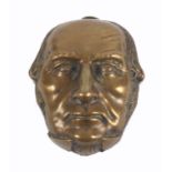 A brass novelty vesta case, in the form of the face of William Ewart Gladstone, 4.7cm.Ê