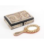 A Victorian shell work writing box and a hand mirror, the writing box of rectangular form the