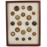 Buttons - a framed display of twenty, mostly featuring portrait busts including a Japanese wooden