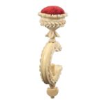 A 19th Century carved ivory sewing clamp, the 'C' form leaf and floral carved frame below a carved