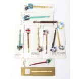 Eleven various lace bobbins, comprising / a wood and a bone example with evil eye beads / a pewter