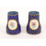 A pair of enamel decorated opera glass grips, 19th Century, French, each with two oval panels of