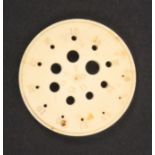 A scarce 19th Century ivory circular knitting needle gauge, inscribed to 24 and stamped to