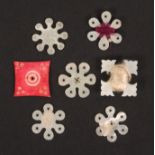 Seven thread winders, comprising six in mother of pearl, five of snowflake form and one of cross