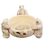 An attractive late 19th Century/early 20th Century Japanese ivory okimono, in the form of a bowl