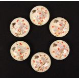 A fine set of six late 19th Century Japanese domed ivory buttons decorated in lacquer and shibayama,