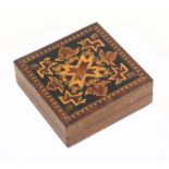 A Tunbridge ware Tangram puzzle, the square rosewood box with a geometric mosaic lid, complete
