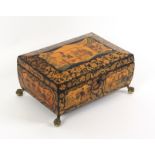 A fine Regency polychrome painted and penwork sewing box of sarcophogal form, raised on gilded brass