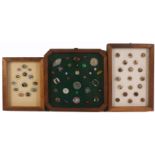 Buttons - three small framed displays, comprising a frame of thirteen glass paperweight buttons,