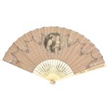 An early 19th Century print and paper decorated fan, the pierced, carved and shaped guards to