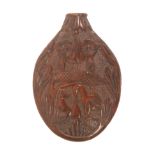 A mid 19th Century French carved coquilla scent flask, of oval form carved with the fox and the