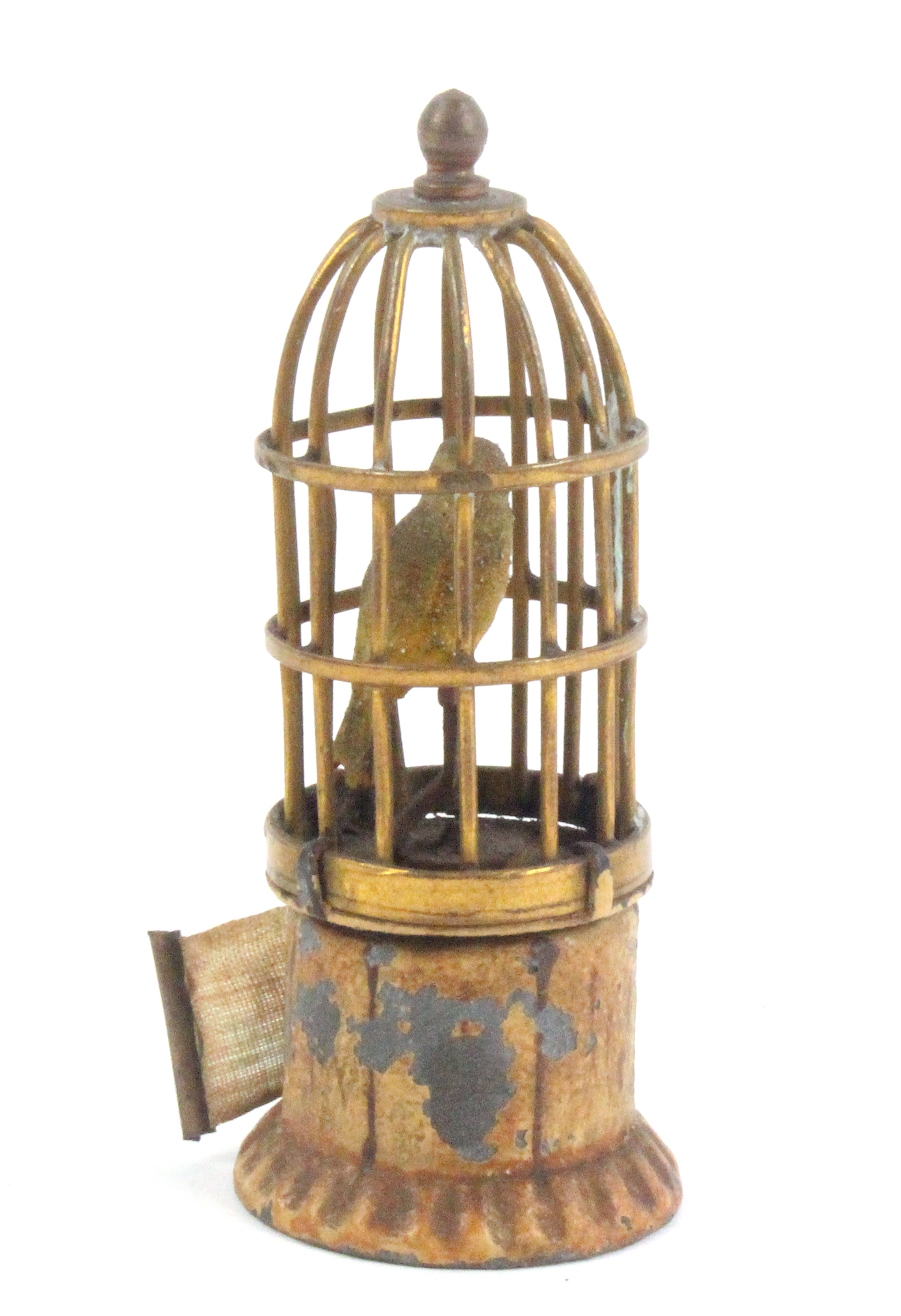 An Austrian cold painted brass novelty tape measure in the form of a bird cage, the tape wound by