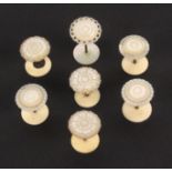 Six reel holders, all with bone bases, brass stems and mother of pearl tops comprising two sets each