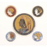 Five porcelain circular plaques presumably for buttons, comprising a large example with female