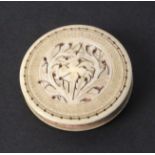 A 19th Century pin cushion of disc form, each side domed and pierced with a floral design