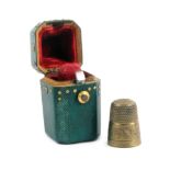A fine 18th Century gold studded green shagreen thimble case, of canted square section below a