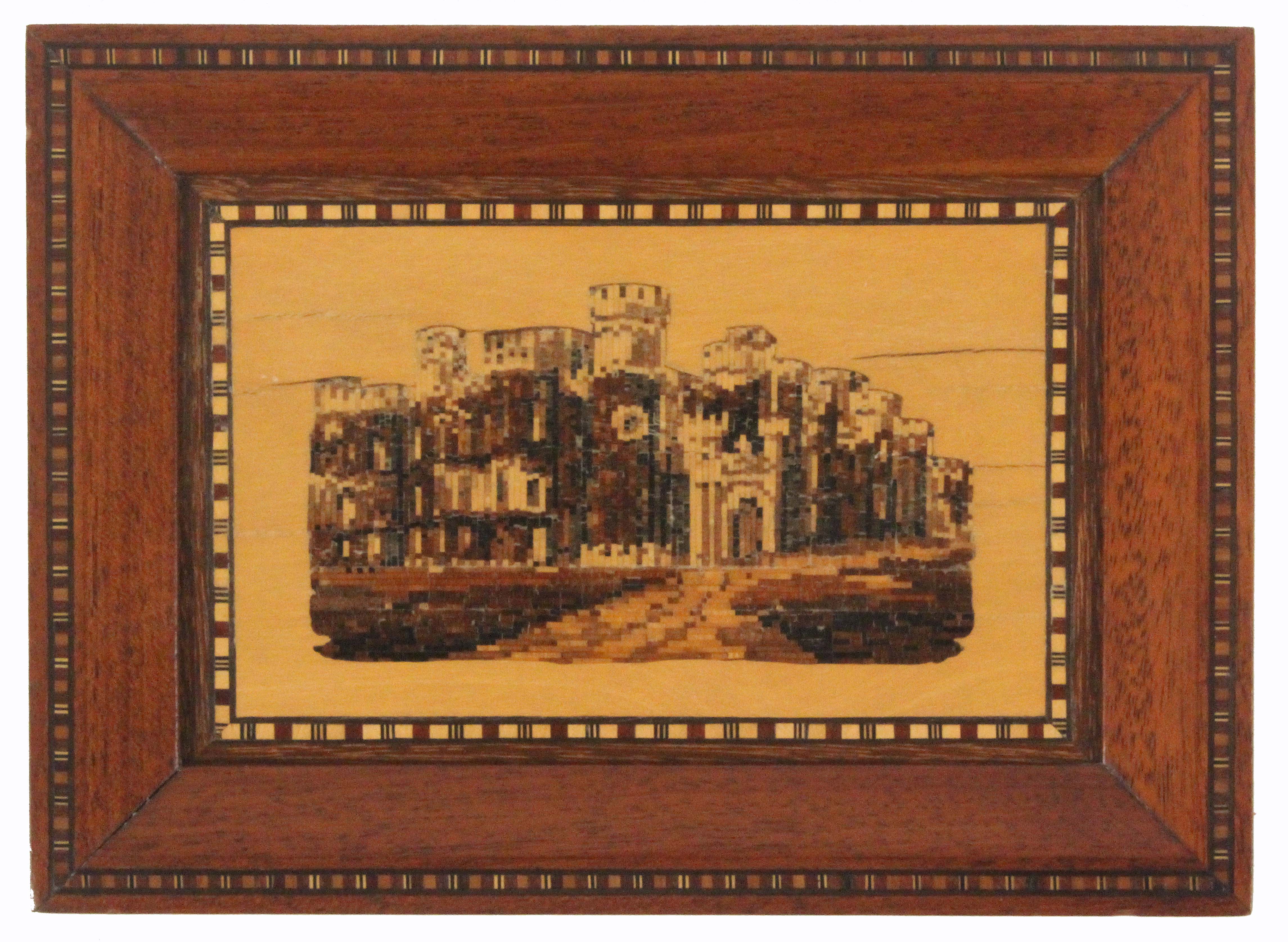 A Tunbridge ware framed panel of Eridge Castle, in mosaic set within white wood within a geometric