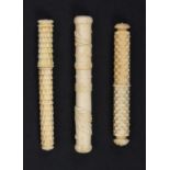 Three 19th Century cylinder form ivory needle cases, comprising a stacked brick example with