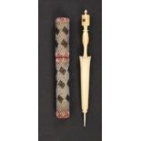Two needle cases, comprising an attractive cylinder example decorated in coloured beadwork with