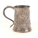 A Georgian silver mug, of tapering cylinder form with typical scroll handle, later engraved