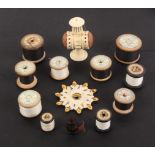 A mixed lot - sewing, comprising a bone standing double ended pin cushion below a tape measure