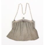 An early 20th Century French silver chain mesh bag, the decorated silver mount with acorn clasp,