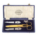 A cased pair of 'Everserver 'DB' Scissors', in gilt metal, variously stamped and with patent, in