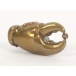 A brass novelty vesta case, in the form of a crabs claw, a jewel in its pincers, 5.5cm.Ê